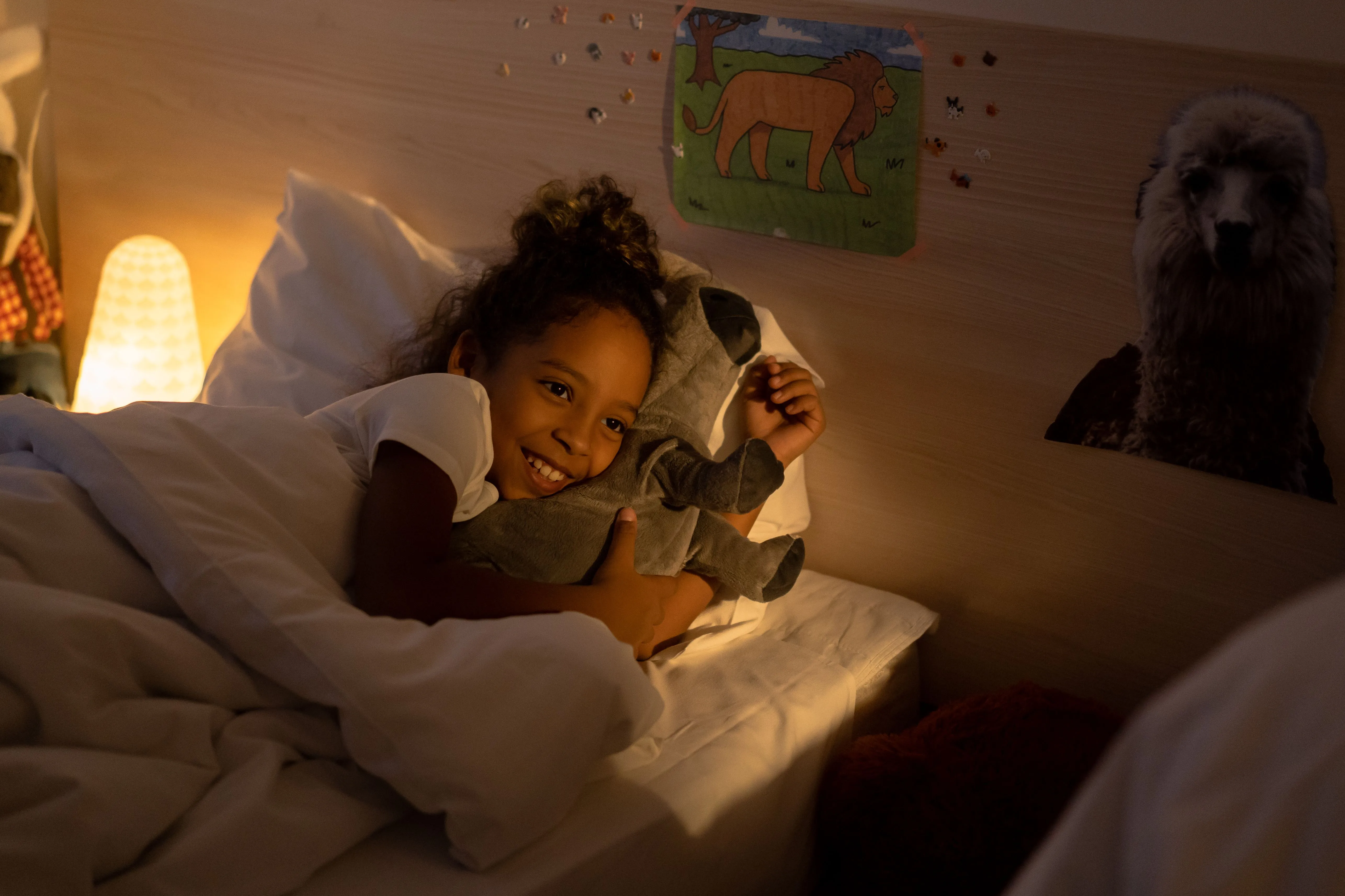Person using a phone in bed at night