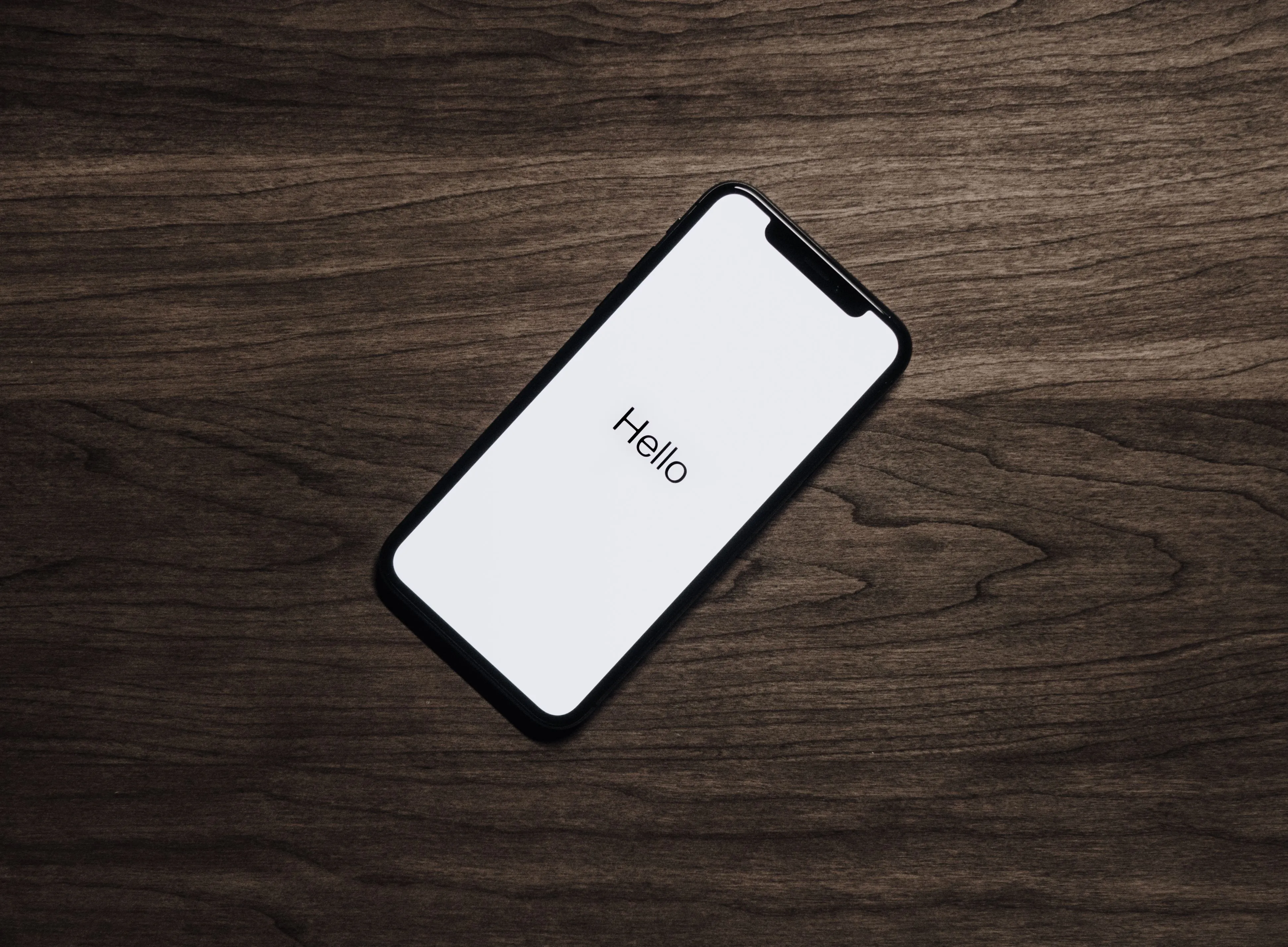 Hand holding an iPhone